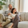 a couple sitting on a couch together